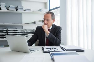 A corporate lawyer going through documents.